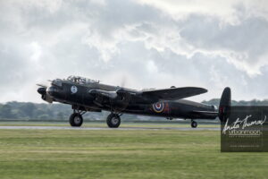 Aviation photography - The Avro Lancaster Mk. X of the Canadian Warplane Heritage Museum in Hamilton, Ontario taxis on the runway. It is one of only two remaining flying Lancs.
(C)Anita Thomas All Rights Reserved. avro lancaster
