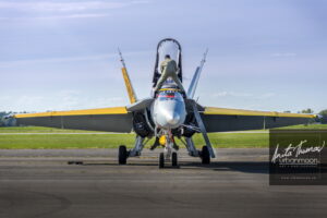 Aviation photography - Captain Ryan Kean straddles the CF-18 Hornet at the Brantford Rotary airshow. The 2016 paint theme celebrates the 75th anniversary of the British Commonwealth Air Training Plan.
(C)Anita Thomas All Rights Reserved. cf hornet