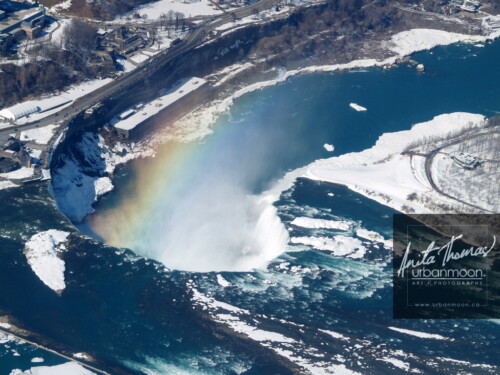 Aerial destinations - The Niagara River looks very cold on this winter day as it pours over the falls in Niagara Falls, Canada.
© Anita Thomas - Urbanmoon. All Rights Reserved. aerial niagara falls ontario
