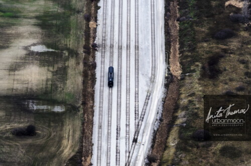 Aerial photography - Aerial of a lone train car on a railway track.
(C)Anita Thomas All Rights Reserved. aerial of a lone train car on a track