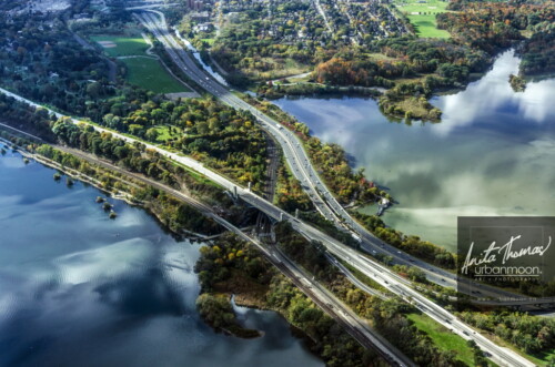 Aerial photography - Light dance on the gates to the city: The Dundurn area of Hamilton with Cootes Paradise, Lake Ontario, Highway 403, York Blvd, the rail line and more, all being danced upon by the beautiful light and clouds.
(C)Anita Thomas All Rights Reserved. aerial photography of cootes paradise