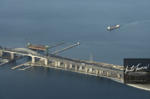 Aerial photography - A ship comes into Burlington Bay, passing through the lift bridge and under the Skyway Bridge to dock at the port of Hamilton.
(C)Anita Thomas All Rights Reserved. aerial photography of hamilton ontario