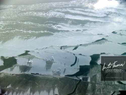 Aerial photography - Lake Erie in winter. Frozen Lake Erie and its snow drifts on a cold -30C winter's day.
(C)Anita Thomas All Rights Reserved. aerial photography of lake erie in winter