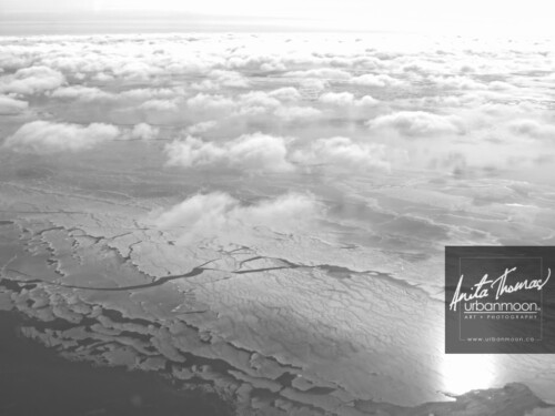Aerial photography - Aerial photography of Lake Erie in winter. The sun glares off of frozen Lake Erie and its snow drifts on a cold -30C winter's day.
(C)Anita Thomas All Rights Reserved. aerial photography of lake erie in winter