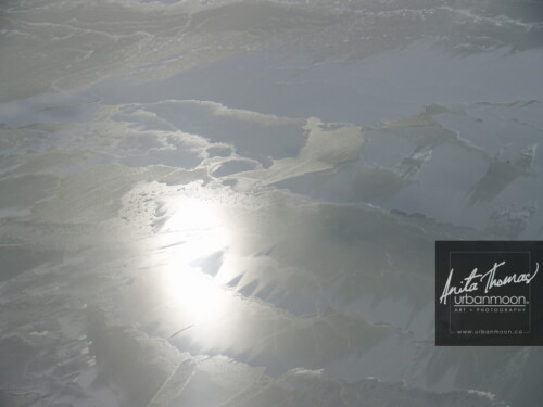 Aerial photography - Aerial photography of Lake Erie in winter. The sun glares off of frozen Lake Erie and its snow drifts on a cold -30C winter's day.
(C)Anita Thomas All Rights Reserved. aerial photography of lake erie in winter