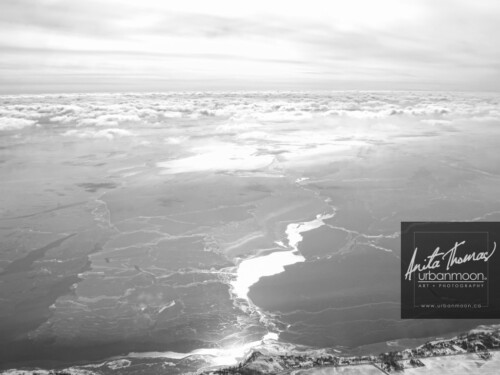 Aerial photography - Aerial photography of Lake Erie in winter. The sun glares off of frozen Lake Erie and its snow drifts on a cold -30C winter's day.
(C)Anita Thomas All Rights Reserved. aerial photography of lake erie in winter