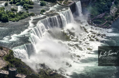 Aerial photography - The American Falls, one of three waterfalls that together are known as Niagara Falls on the Niagara River along the Canada and U.S. border.
(C)Anita Thomas All Rights Reserved. aerial photography of niagara falls