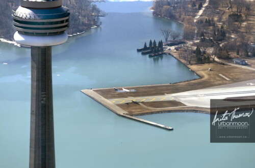 Aerial photography - Toronto, Ontario, the CN Tower and a Porter Airlines jet landing at Billy Bishop Airport on Toronto Islands.
(C)Anita Thomas All Rights Reserved. aerial photography of toronto ontario