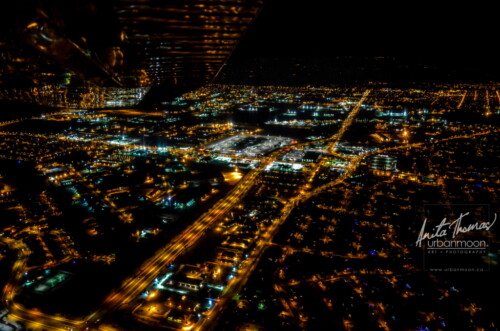 Aerial photography - The city of Brantford, Ontario is shines and glimmers as it reflects off the wing of a plane.
(C)Anita Thomas All Rights Reserved. aerial shot of the city of brantford at night