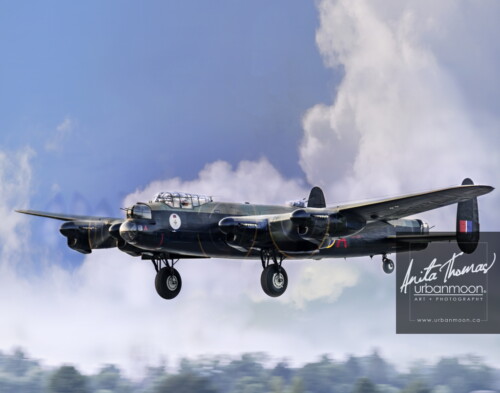 Aviation photography - The Avro Lancaster Mk. X of the Canadian Warplane Heritage Museum in Hamilton, Ontario flies past. It is one of only two remaining flying Lancs.
© Anita Thomas - Urbanmoon. All Rights Reserved. avro lancaster