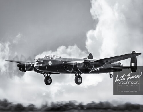 Aviation photography - The Avro Lancaster Mk. X of the Canadian Warplane Heritage Museum in Hamilton, Ontario flies past. It is one of only two remaining flying Lancs.
© Anita Thomas - Urbanmoon. All Rights Reserved. avro lancaster