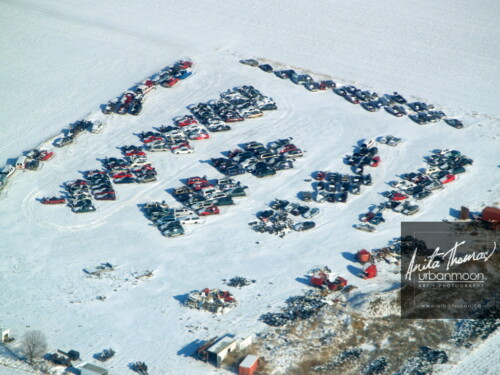 Aerial photography - An auto graveyard somewhere in Southern Ontario, Canada during winter.
(C)Anita Thomas All Rights Reserved. car junkyard in winter