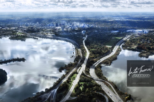 Aerial photography - The Dundurn area of Hamilton with Cootes Paradise, Lake Ontario, Highway 403, York Blvd, the rail line and more, all being danced upon by the beautiful light and clouds.
(C)Anita Thomas All Rights Reserved. light dance on the gates to the city