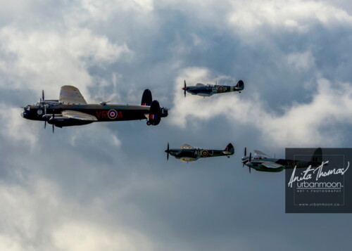 Aviation photography - The Avro Lancaster Mk. X bomber flies past during an airshow along with the world's only flying de Havilland DH-98 Mosquito, a Supermarine MK-1XE Spitfire, and a Supermarine Spitfire LF Mk. XVIe at the Canadian Warplane Heritage Museum in Hamilton, Ontario, Canada.
© Anita Thomas - Urbanmoon. All Rights Reserved. merlin formation