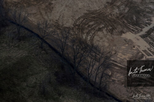 Aerial photography - Tractor marks in a muddy field in rural Ontario.
(C)Anita Thomas All Rights Reserved. tractor marks in mud