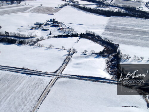 Aerial photography - A road intersects on a snowy, winter's day in rural Ontario, Canada.
© Anita Thomas - Urbanmoon. All Rights Reserved. winter in the country