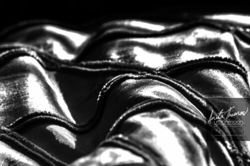 Black and white photography - The folds of a taffeta and chenille pillow create shadows and highlights from sunshine streaming through a window.
© Anita Thomas - Urbanmoon. All Rights Reserved. a sunlit cushion