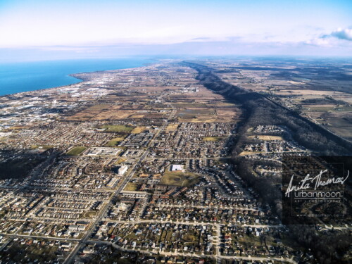 Aerial photography - Part of the City of Hamilton, Stoney Creek is to the east and parts of it  run up the Niagara Escarpment as you can see here in this photo.
© Anita Thomas - Urbanmoon. All Rights Reserved. aerial photography of stoney creek