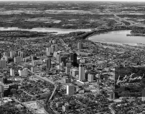 Aerial photography - Downtown Hamilton looking toward Cootes Paradise, with the Go Train winding up from the bottom centre of the photo.
© Anita Thomas - Urbanmoon. All Rights Reserved. aerial photography of the city of hamilton