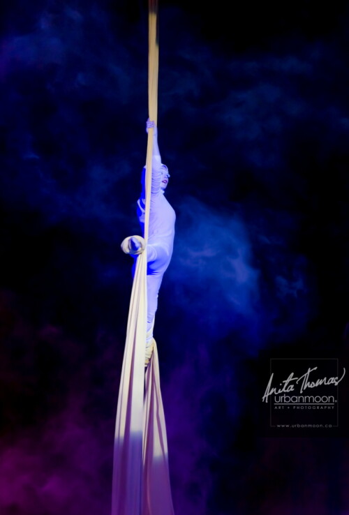 Lifestyle photography - An aerialist performs with Circus Orange at Supercrawl 2013 in Hamilton, Ontario. Scenes captured of the performers and visitors at Supercrawl in Hamilton, Ontario.
© Anita Thomas - Urbanmoon Photography. All Rights Reserved. aerialist performs