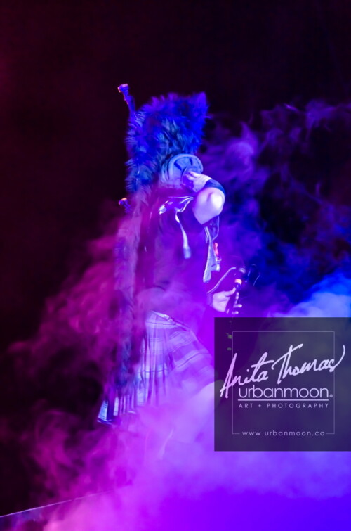 Lifestyle photography - The bagpiper of Circus Orange wants to HEAR YOU at Supercrawl 2013 in Hamilton, Ontario! Scenes captured of the performers and visitors at Supercrawl in Hamilton, Ontario.
© Anita Thomas - Urbanmoon Photography. All Rights Reserved. bagpiper performs