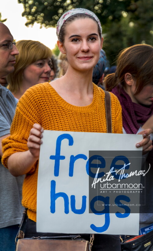 Lifestyle photography - Free hugs at Supercrawl 2013 in Hamilton, Ontario. Scenes captured of the performers and visitors at Supercrawl in Hamilton, Ontario.
© Anita Thomas - Urbanmoon Photography. All Rights Reserved. free hugs
