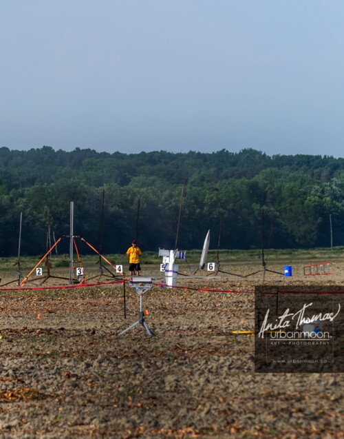 Lifestyle photography - ...and head first into the field, the nose cone just about to land.
URRF, high-powered rocketry competition hosted by URRG in Potter, New York, United States.
© Anita Thomas - Urbanmoon Photography. All Rights Reserved. high powered rocketry