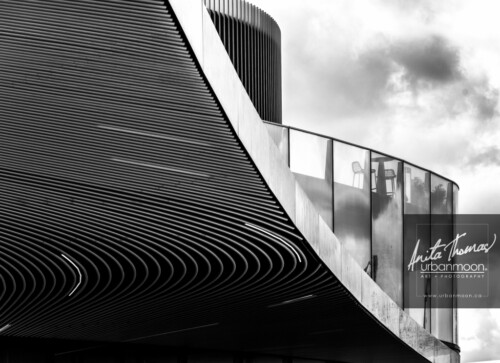 Black and white photography - The lines of this building echo waves as it envelops its core. Found in North Greenwich, London, United Kingdom.
© Anita Thomas - Urbanmoon. All Rights Reserved. north greenwich london uk