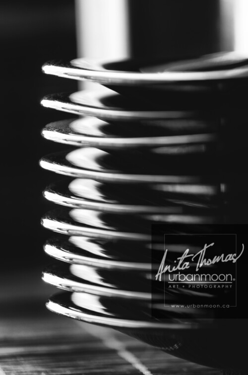 Black and white photography - Plates stacked on a rattan mat catch the sunlight streaming in through a window.
© Anita Thomas - Urbanmoon. All Rights Reserved. plates stacked on a rattan mat
