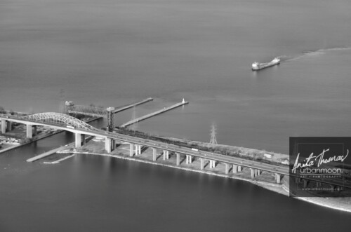 Aerial photography - Ship coming in to pass under the lift bridge and the Skyway bridge as it enters Burlington Bay from Lake Ontario.
© Anita Thomas - Urbanmoon. All Rights Reserved. ship coming in to pass under the skyway bridge