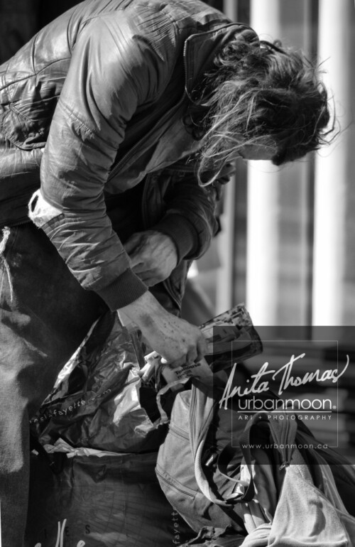 Urban photography - Paris, France
© Anita Thomas - Urbanmoon Photography. All Rights Reserved. street photography homeless man goes through his bags