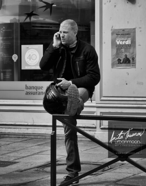 Urban photography - Paris, France
© Anita Thomas - Urbanmoon Photography. All Rights Reserved. street photography man on phone with motorcycle helmet