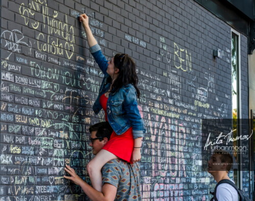 Lifestyle photography - Careful observation happening at Supercrawl 2013 in Hamilton, Ontario. Scenes captured of the performers and visitors at Supercrawl in Hamilton, Ontario.
© Anita Thomas - Urbanmoon Photography. All Rights Reserved. writing on the wall